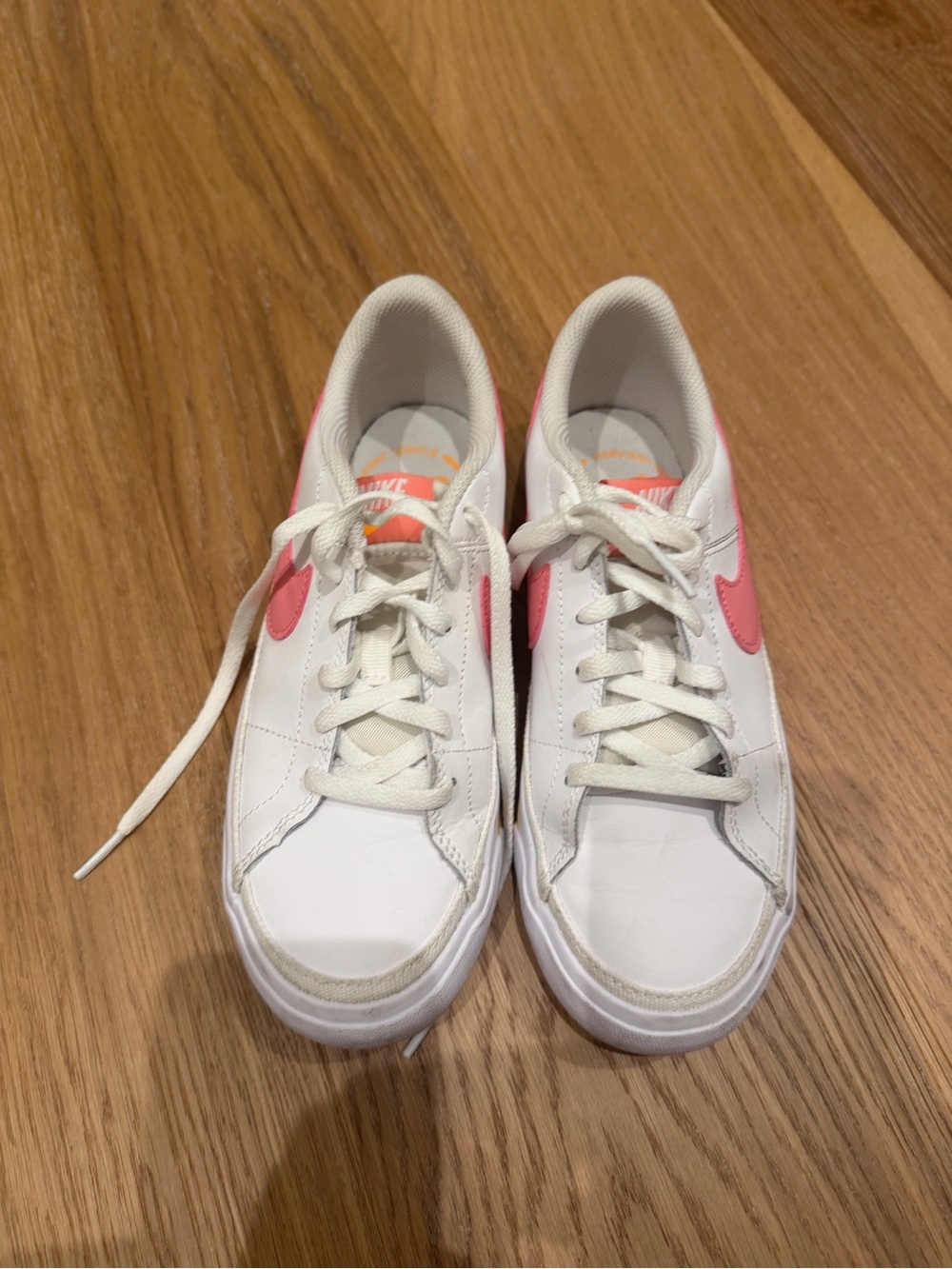 Nike White Low-Top Sneakers with Pink Swoosh